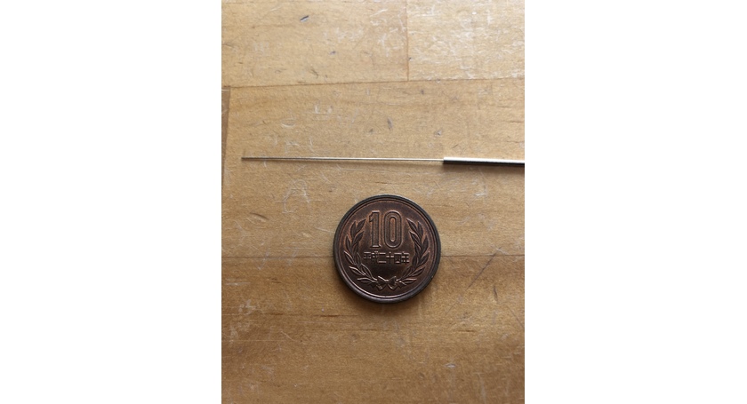 10円玉と鍼